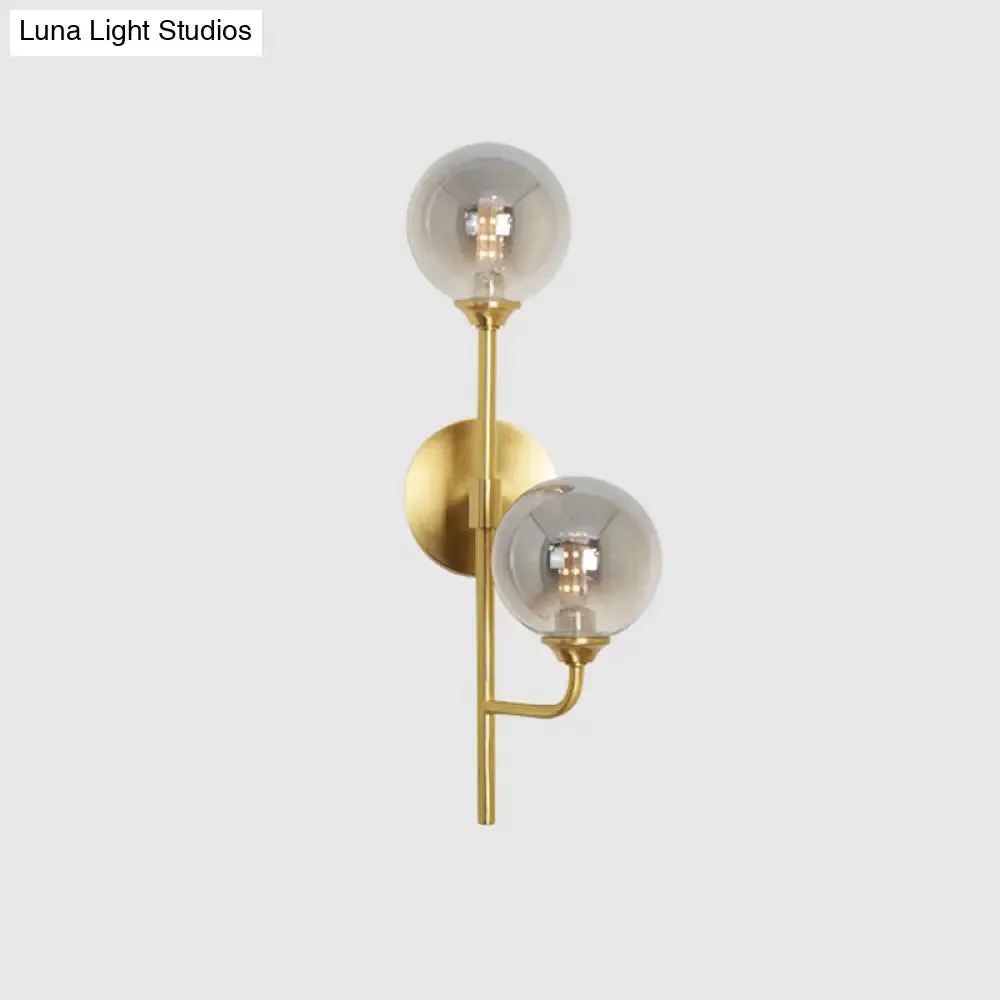 Amber/Smoke Gray Glass 2-Head LED Wall Sconce - Sphere Bathroom Wall Mount Light with Brass Finish