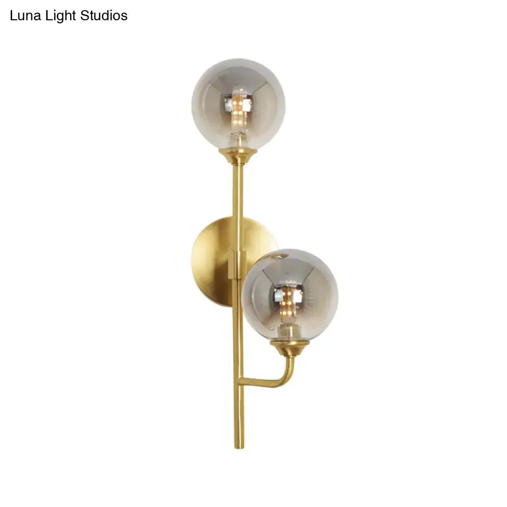 Amber/Smoke Gray Glass 2-Head LED Wall Sconce - Sphere Bathroom Wall Mount Light with Brass Finish