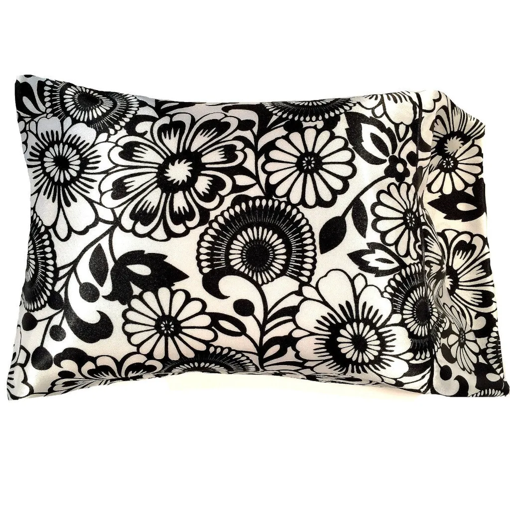 Washable Travel Pillow with a White with Black Flowers Pillow Cover.